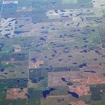 Aerial view of Iowa farm fields peppered with prairie potholes (photo from Iowa Learning Farms blog)