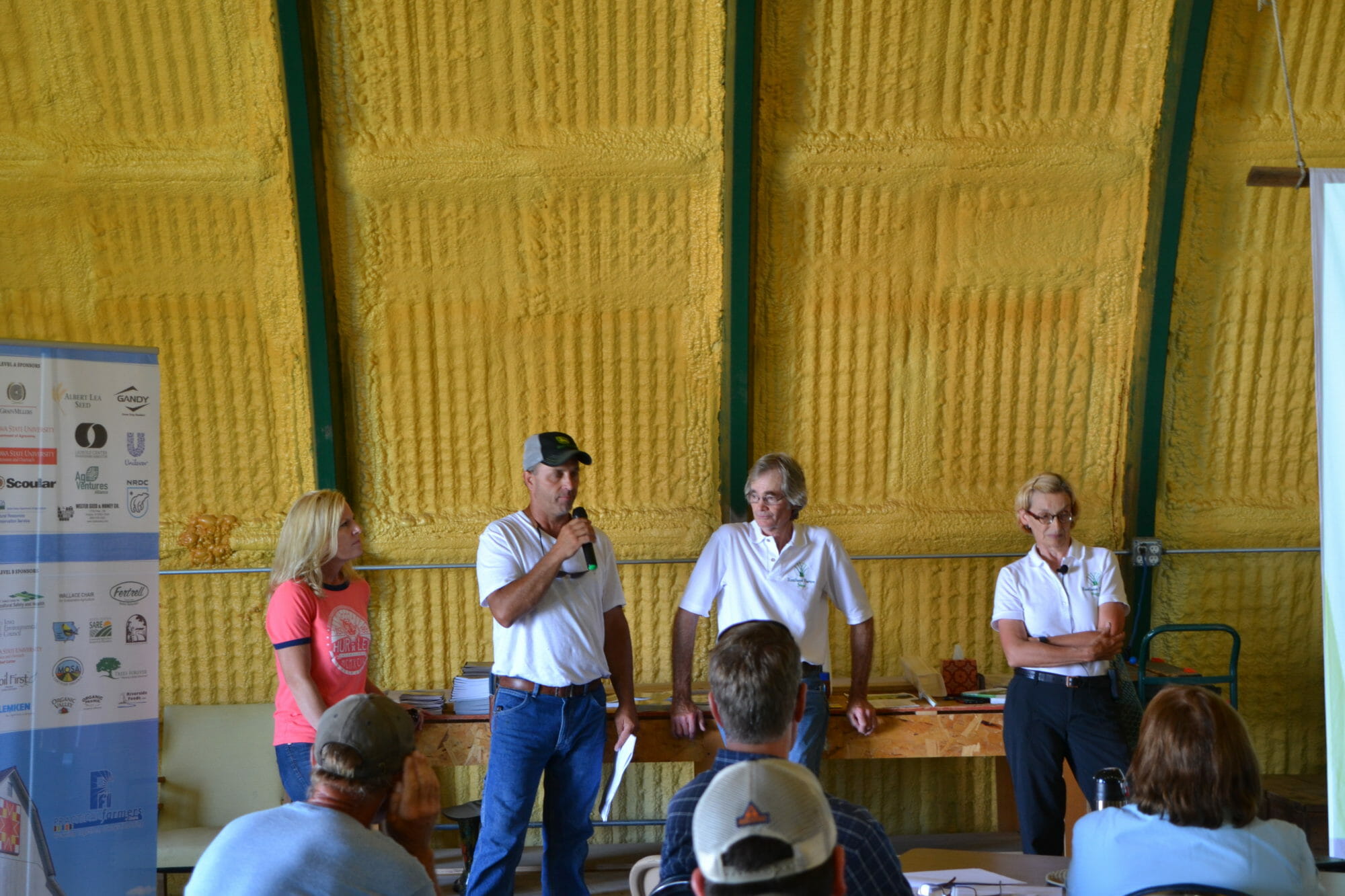 Lisa and Bryan Huff (on left) discuss with Steve and Maggie how they work together to make soil conservation strategies work.